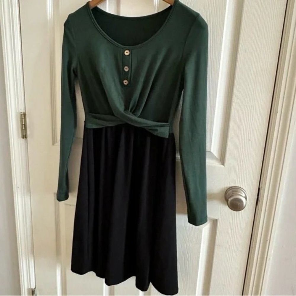 Long sleeved cross front green and black dress with button detail